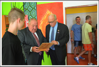 MOAS dormitory - student showing artwork to Tom Cobb and Pat Waters